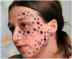 Girl with stars tattooed on her face