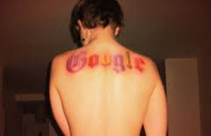 A tattoo endorsing google on the back