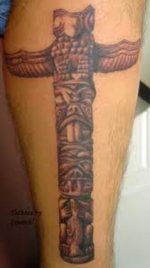 Tattoo of Tribal Totem Pole on Leg