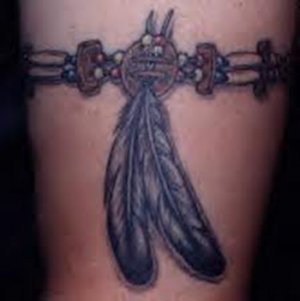 Native American Tattoo of a tribal armband with feathers