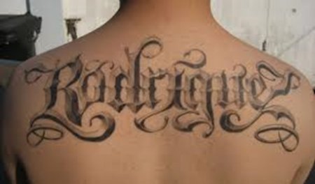 A Grey Wash Rodriguez Tattoo in Old English Lettering