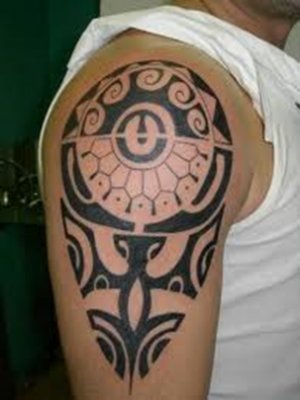 A tribal tattoo on the shoulder.