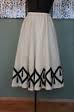 This is an image of a 1940s cream colored wool swing skirt that has circles on it