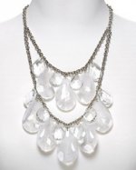 This is a 1950s style necklace and it is made by RJ Graziano. This is a Lucite necklace.
