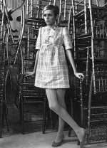 This is an image of twiggy wearing a plaid baby doll dress