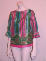 This is a shirt form the 60s that is mulit colored and silk.