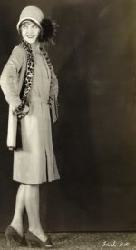 Womens Vintage Clothing from the 1920s. This is an image of a woman from the 1920s with the shorter skirt up to the knee with a split up the side
