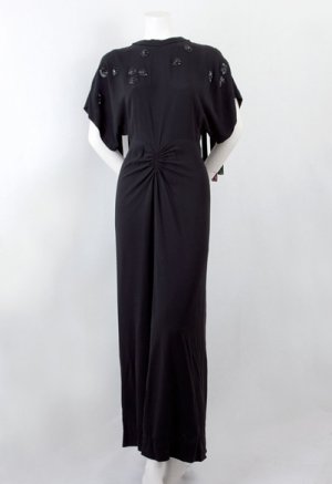 This is an image of an Adrian Beaded evening gown. It is black in color.