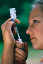 A diabetic girl taking an insulin shot.