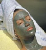 This is an image of a woman having a facial mask on