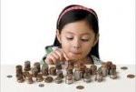 This is am image of a girl counting change