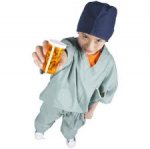 This is an image of a child dressed up like a doctor. Handing out medicine