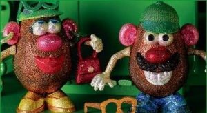 Mr. and Mrs. Potato head dolls that are covered in 14 different colors of Swarovski crystals