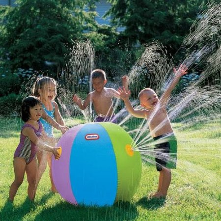 This is an image of a giant beach ball and it is a sprinkler system